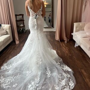 Brand new wedding dress. Never worn or altered.